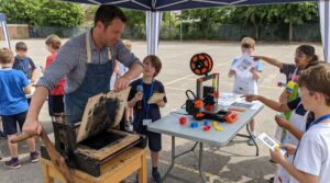 The printing press for kids turns handwriting into many tidy copies. Gutenberg combined movable type, a hand mould, oil ink, and a screw press to make books easier to share and read.